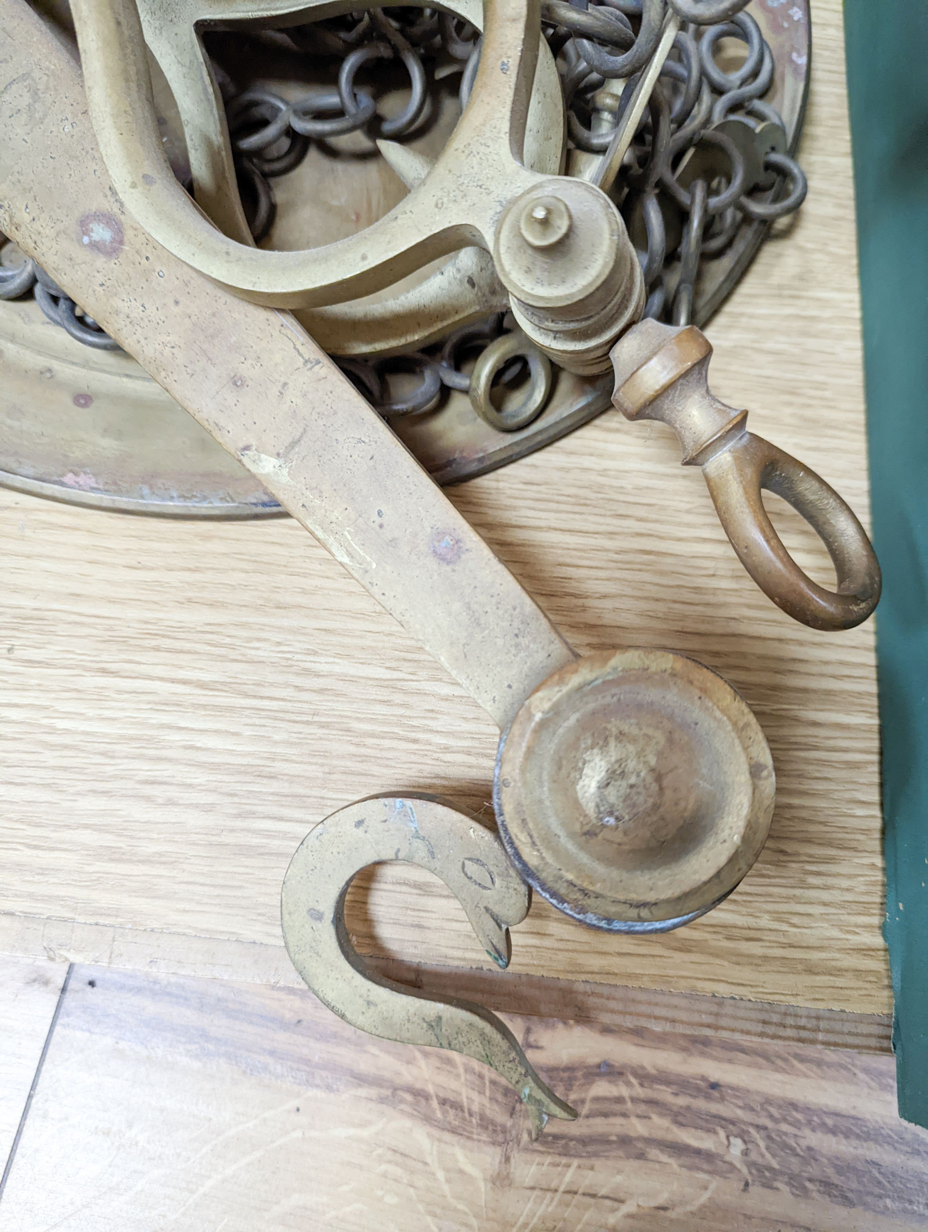 A large set of brass hanging scales, 91cm across
